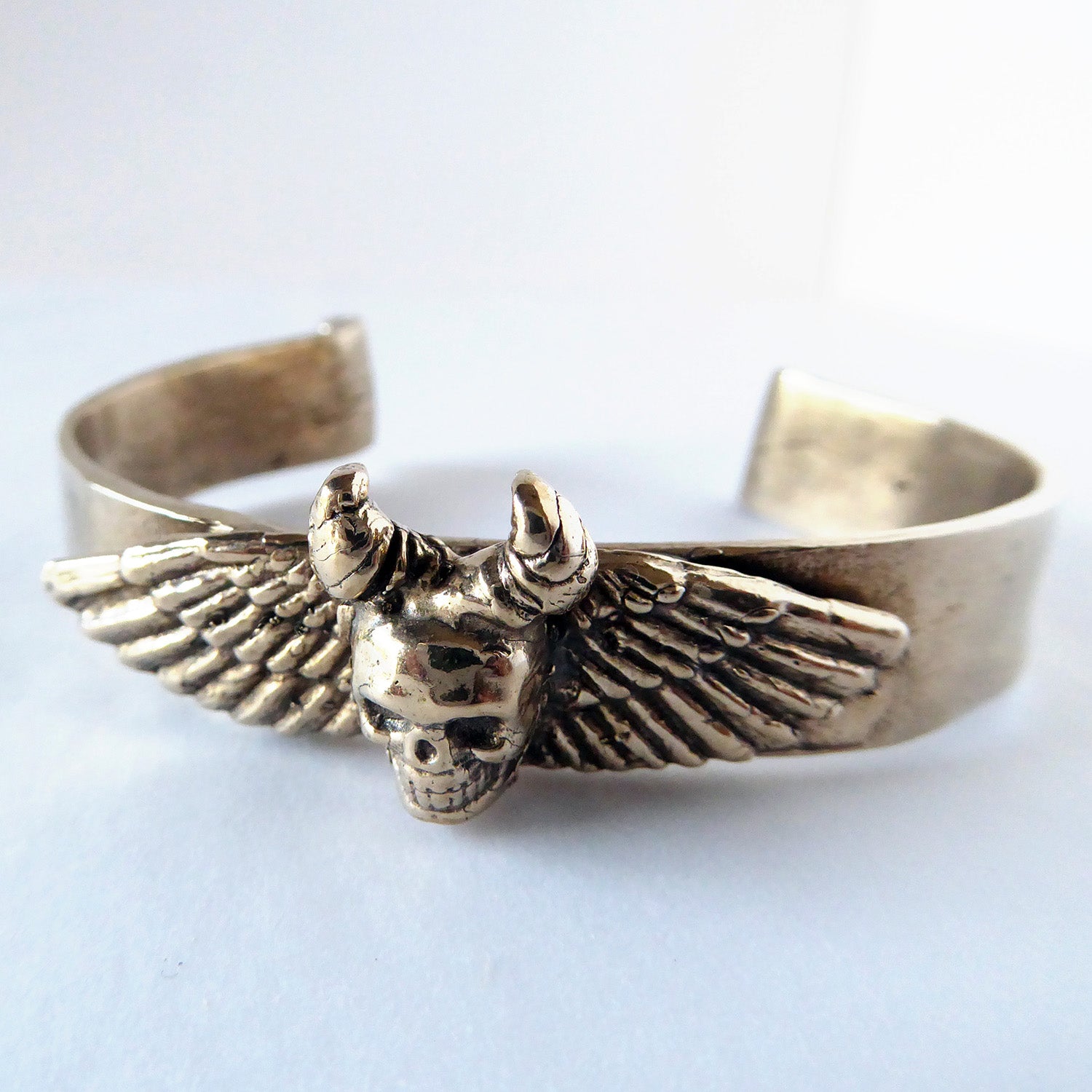 #210 Winged Skull Cuff by Emily Burton