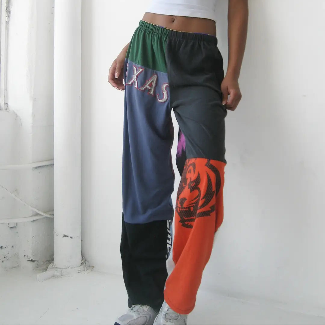 Person wearing colorful, patterned pants with a white background