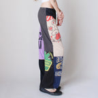 Patchwork pants with various patches on a plain background