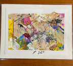 An abstract expressionist painting on textured paper with a wide white border, signed '1st 2024' at the bottom, photographed flat on a wooden surface.