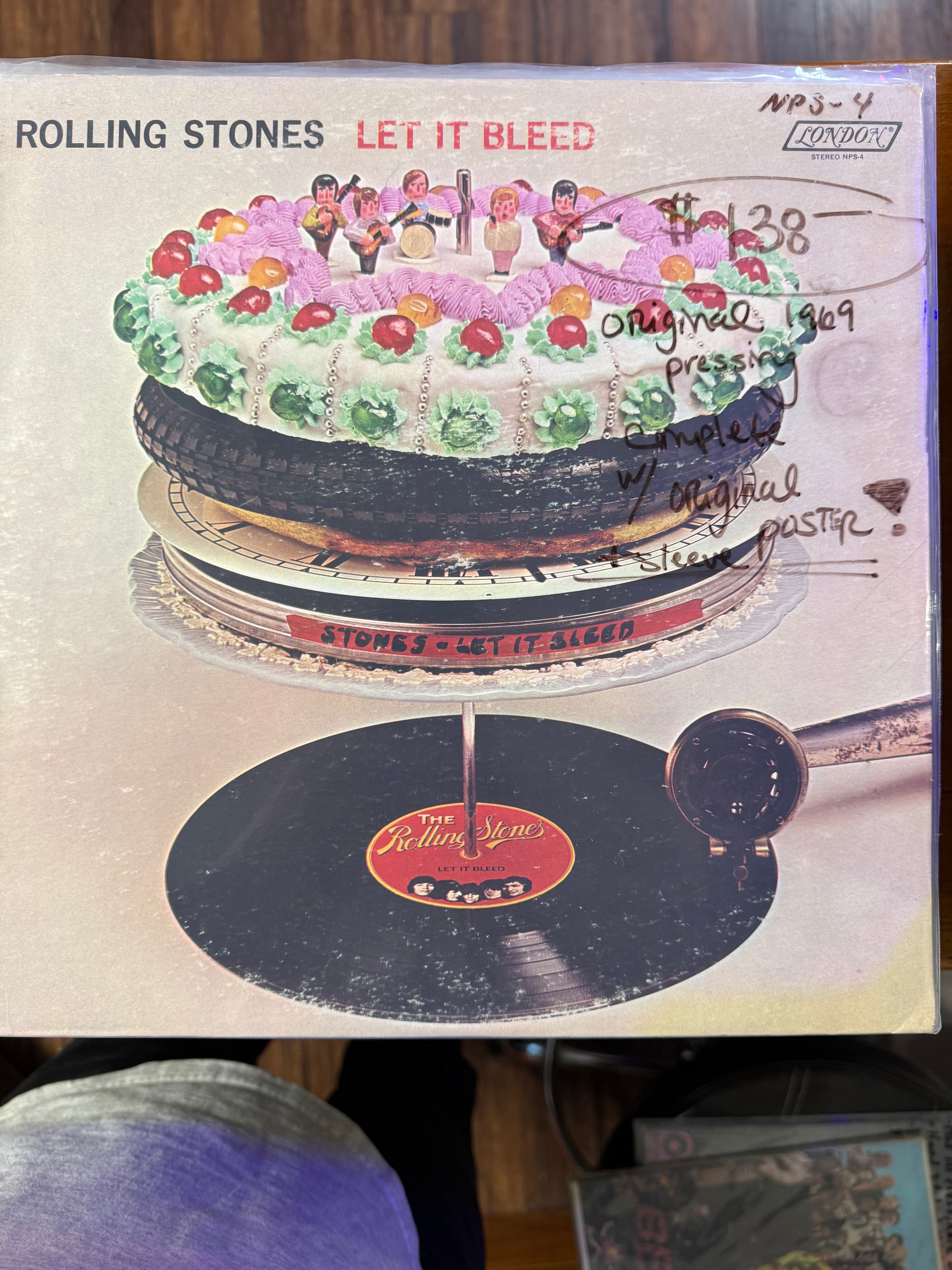 Vintage 1969 original pressing vinyl record jacket for The Rolling Stones Let It Bleed on London Records, featuring the surreal multi-tier cake sculpture artwork.