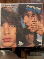 Vintage 1976 first-pressing vinyl record jacket for The Rolling Stones Black and Blue, featuring close-up portrait photography of the band members against a blue sky.