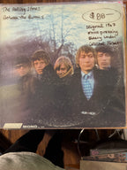 Vintage 1967 original mono pressing vinyl record jacket for The Rolling Stones Between the Buttons on London Records, featuring a blurred outdoor group portrait of the band members.