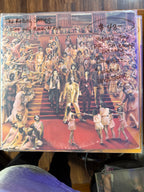 Vintage 1974 original pressing vinyl record jacket for The Rolling Stones It's Only Rock 'N Roll, featuring the band descending a grand staircase surrounded by an applauding crowd.