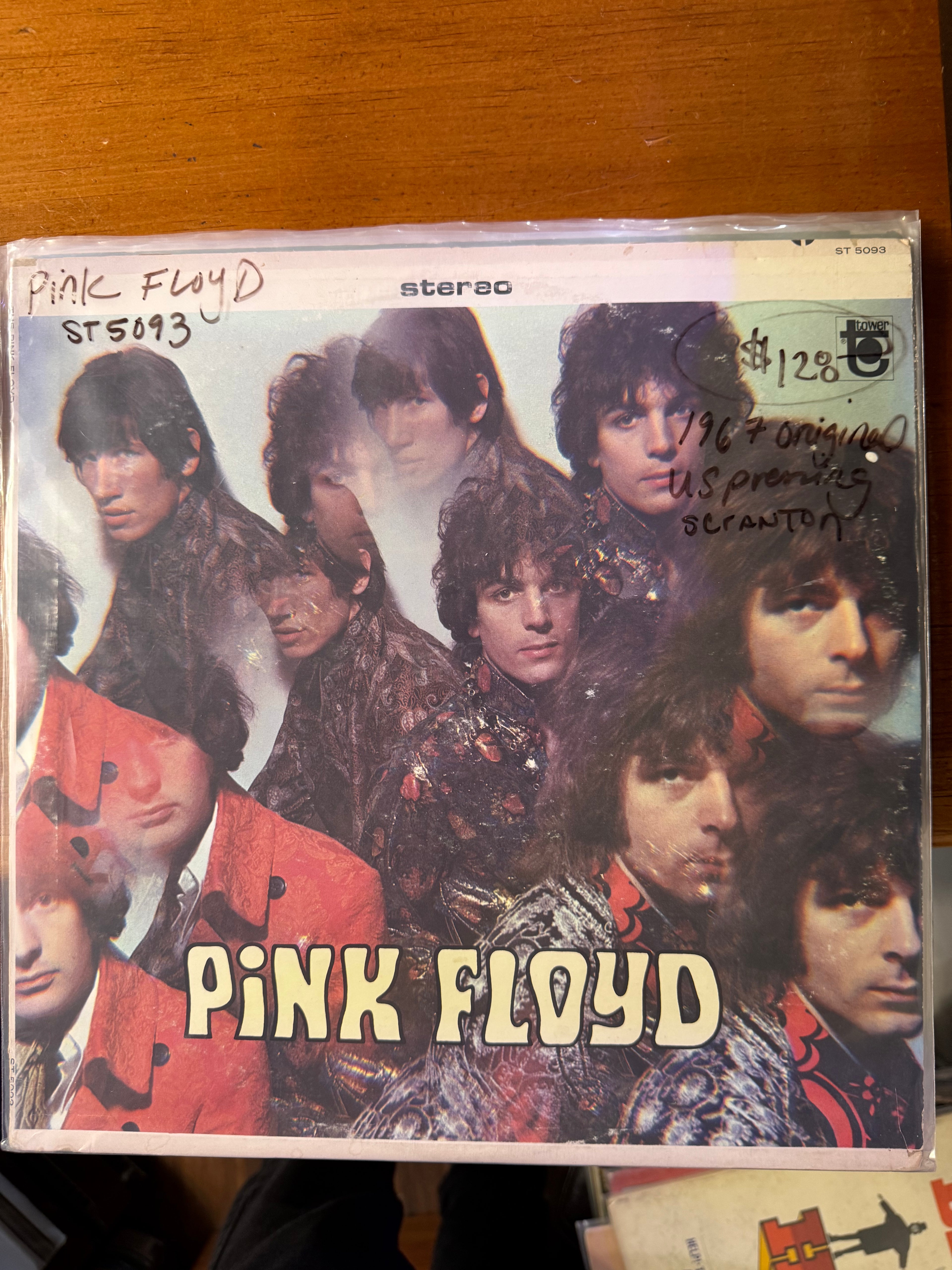 Front jacket cover of Pink Floyd's 1967 debut US vinyl LP on Tower Records, featuring Vic Singh's kaleidoscopic multi-exposure photograph of the band in 1960s velvet clothing with "Pink Floyd" printed at the bottom.