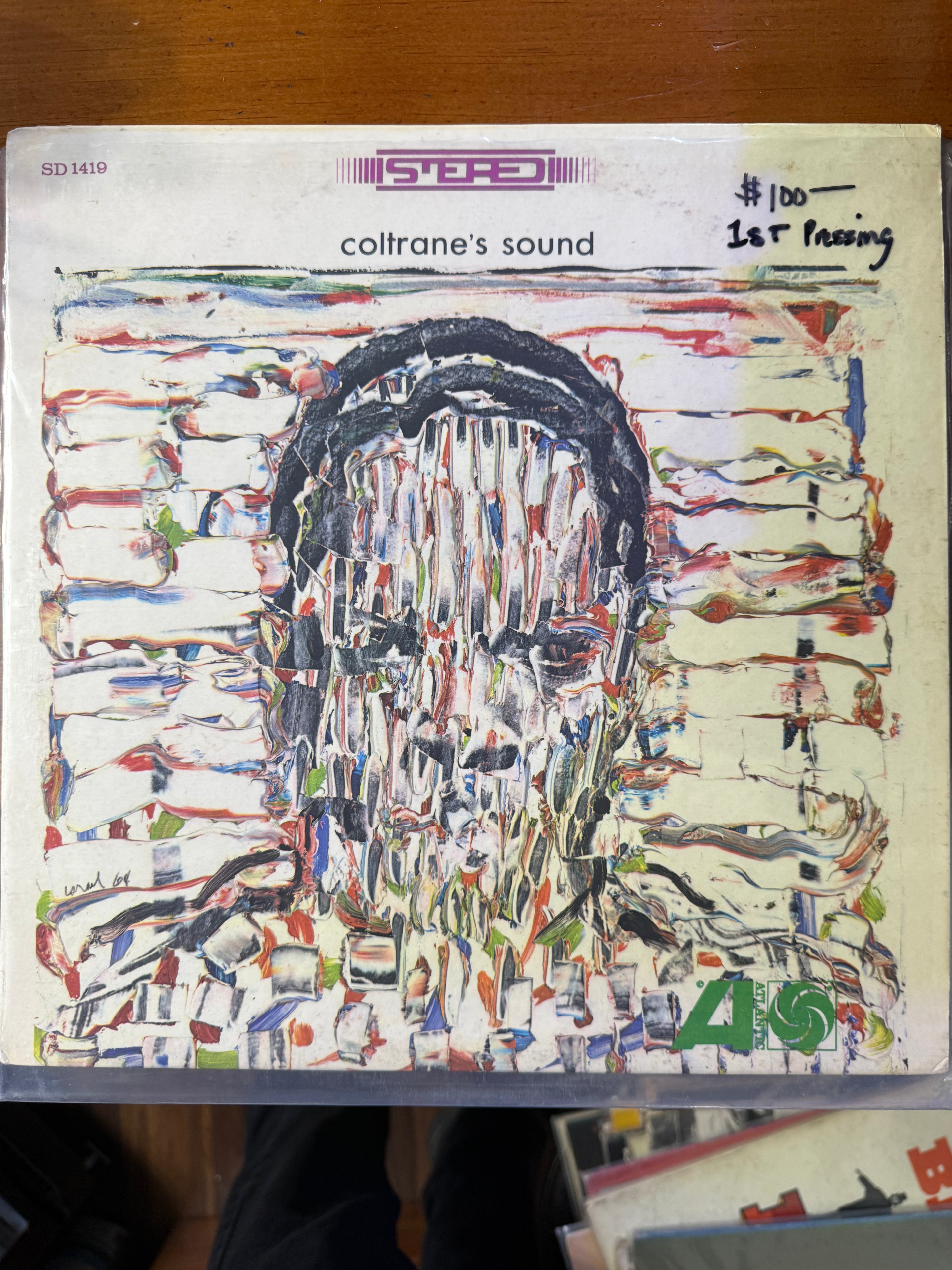 Front cover of John Coltrane's vinyl album Coltrane's Sound on Atlantic Records, featuring an abstract impasto portrait of John Coltrane in textured white, black, and red paint.