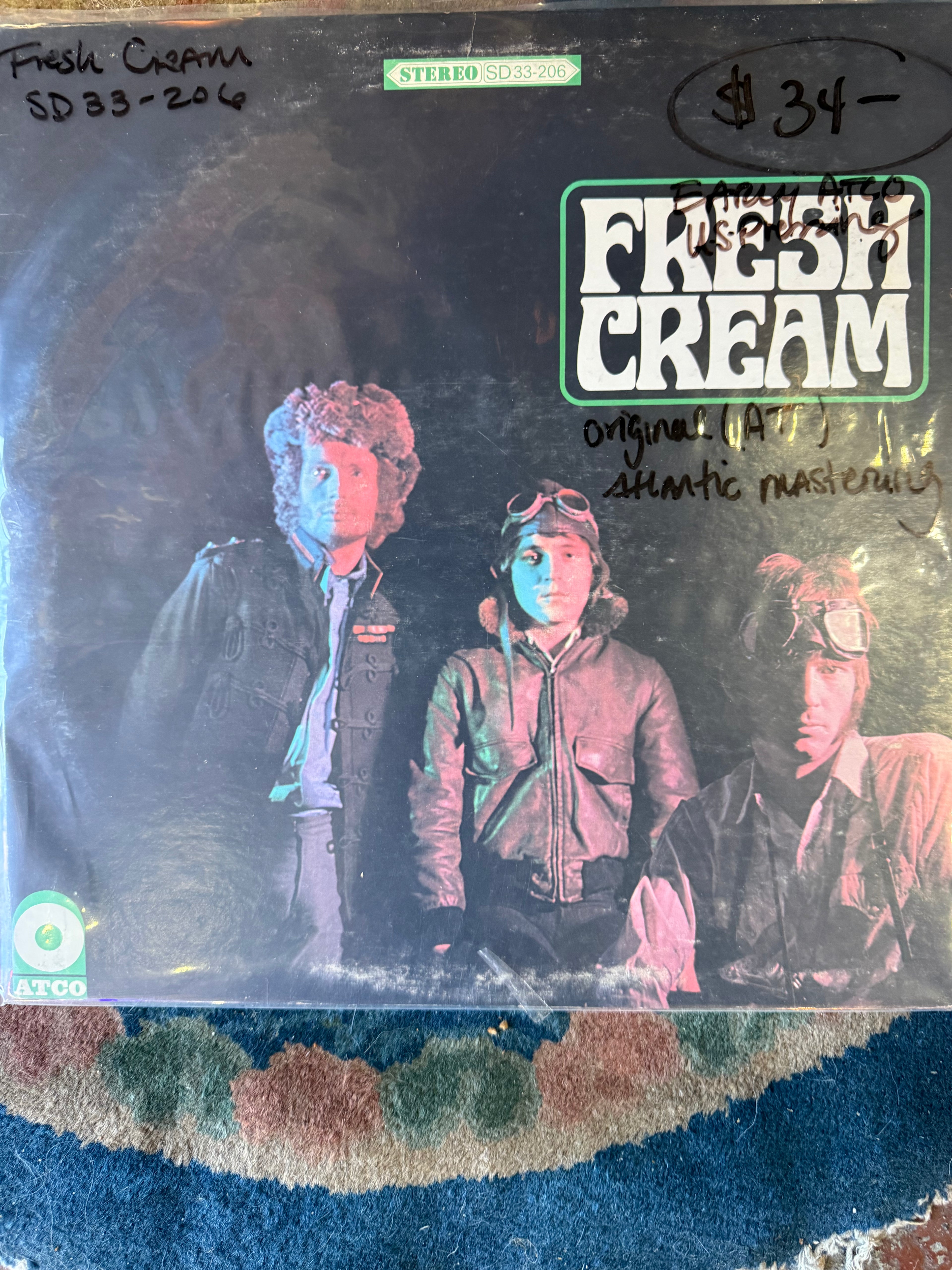 Vintage vinyl record album jacket for Fresh Cream by Cream, showing band members Eric Clapton, Jack Bruce, and Ginger Baker in dark jackets with the green ATCO stereo logo.