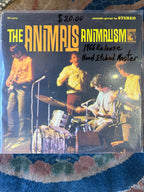 Vintage vinyl record cover for The Animals 1966 album Animalism, featuring a live stage concert photo of the band with bold yellow and orange text.