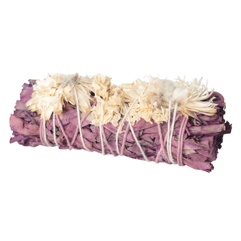 Sage bundle with flowers tied together on a white background